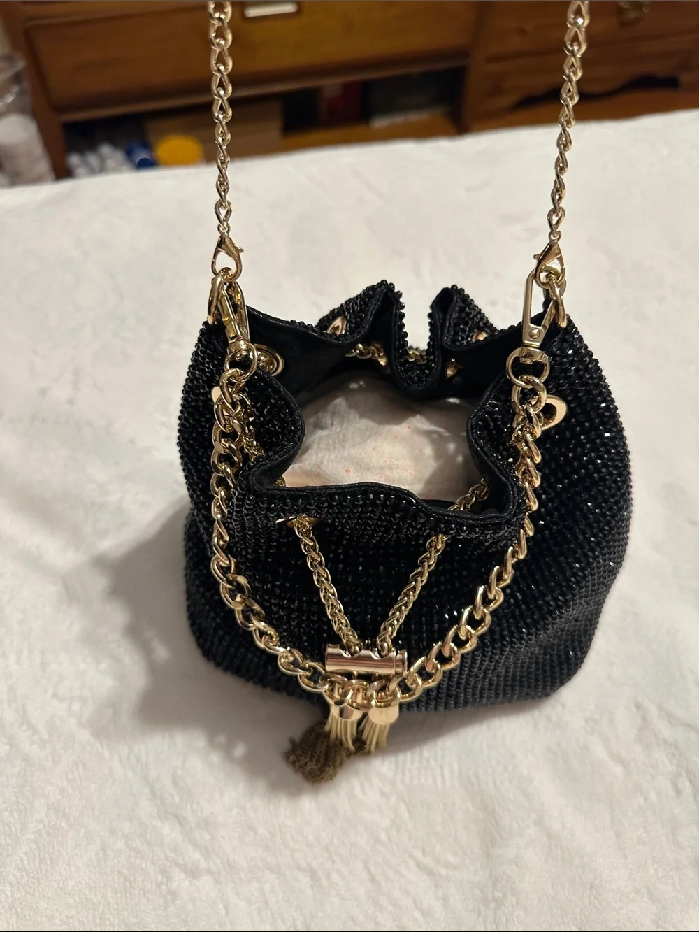Olga Berg Black Beaded Crossbody Bucket Bag with Gold Chain & Tassels